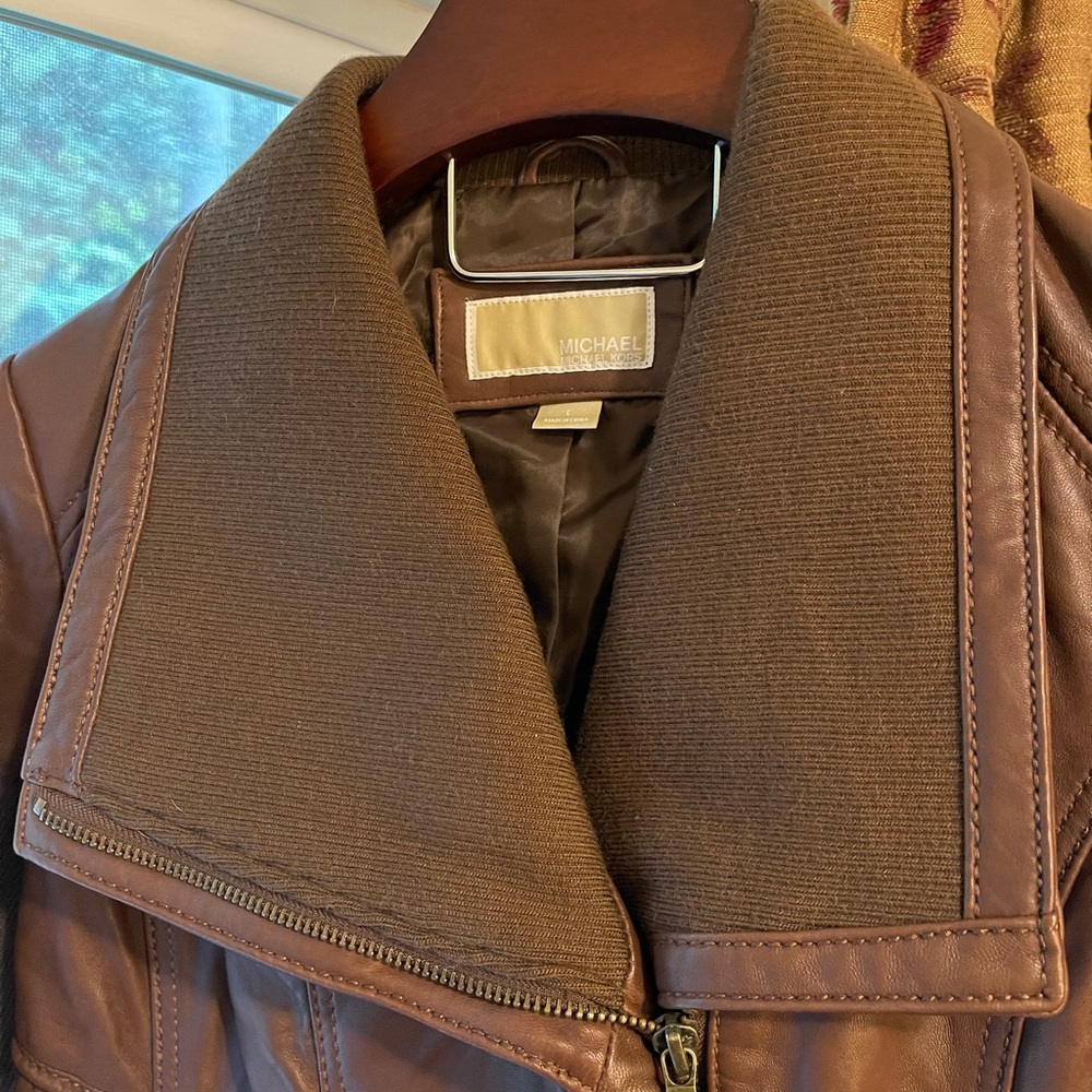 Women’s cropped leather jacket by Michael Kors.